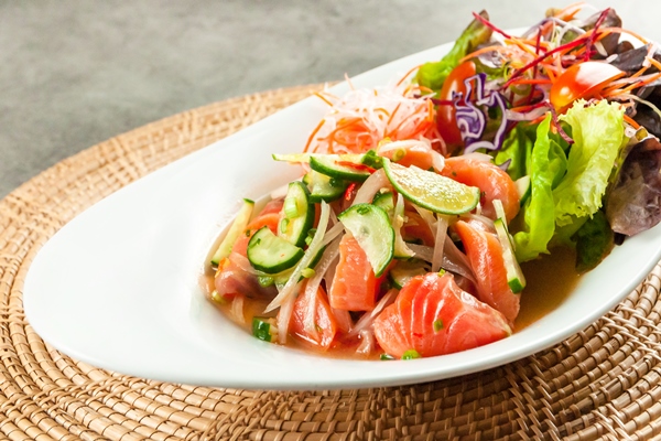 thai spicy salad in a thai restaurant - Салат с лососем и овощами