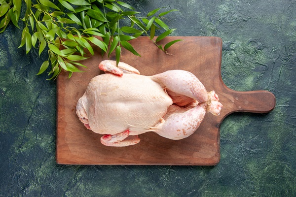 top view fresh chicken with green leaves on dark blue surface - Густой куриный суп с фасолью