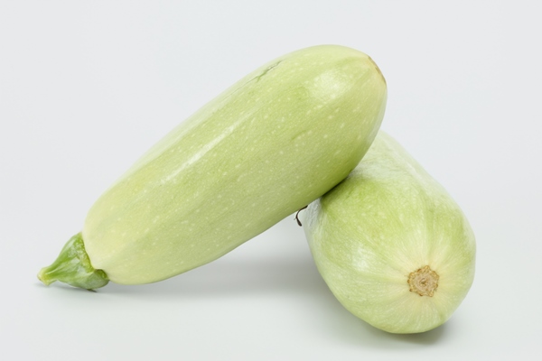 vibrant green zucchini isolated on white background fresh and nutritious vegetables - Суп-пюре из чеснока