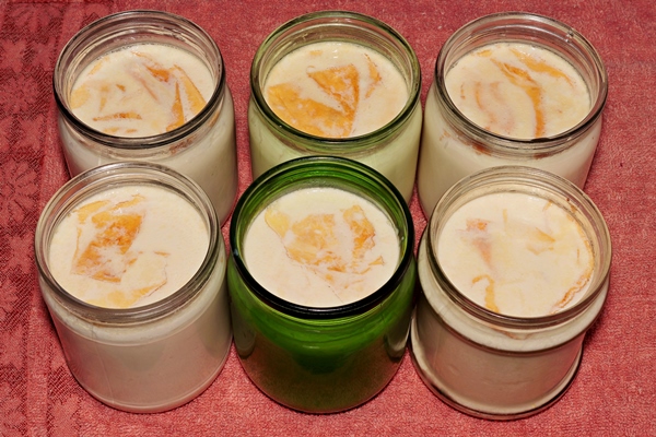 depicted cans with homemade fermented baked milk - Варенец
