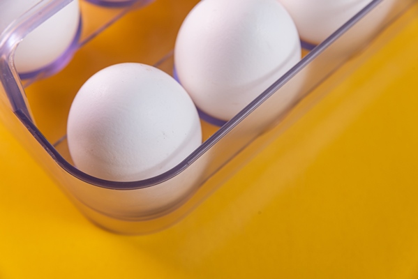 eggs yellow background - Вафли на кефире