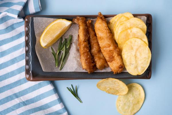 flat lay of delicious fish and chips concept - Рыба в кляре