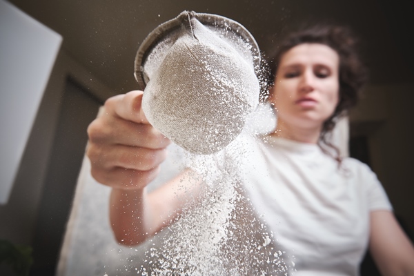 flour is sieved with metal sieve 1 - Вафли на сметане