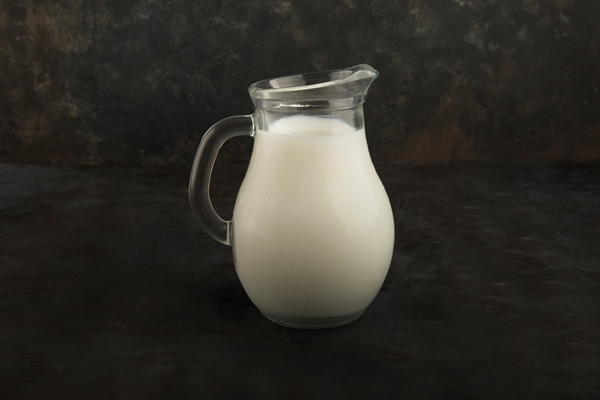 fresh milk glass jar black background - Пшённая каша в мультиварке