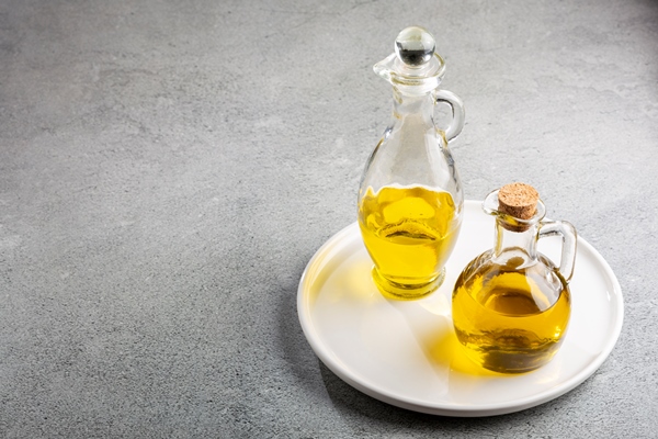 glass cruet olive oil in a glass cruet - Оладьи яблочные дрожжевые, постный стол