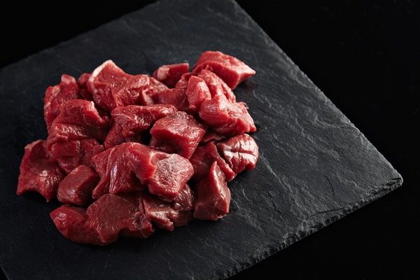 pieces raw fresh meat isolated black stone board side - Борщ в мультиварке