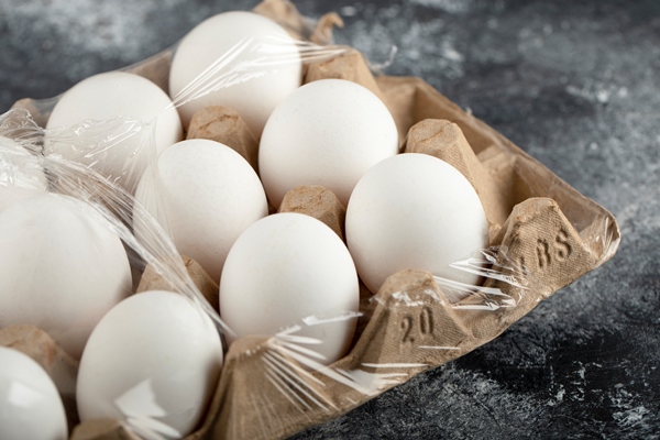 raw chicken eggs egg box marble surface - Вафли из дрожжевого теста