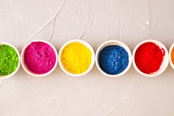 row holi color powder bowls concrete textured background - Мастика сахарная сырцовая
