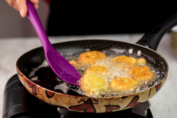 selected focus frying potato nugget perkedel kentang home cooking process in the kitchen - Оладьи с изюмом, постный стол