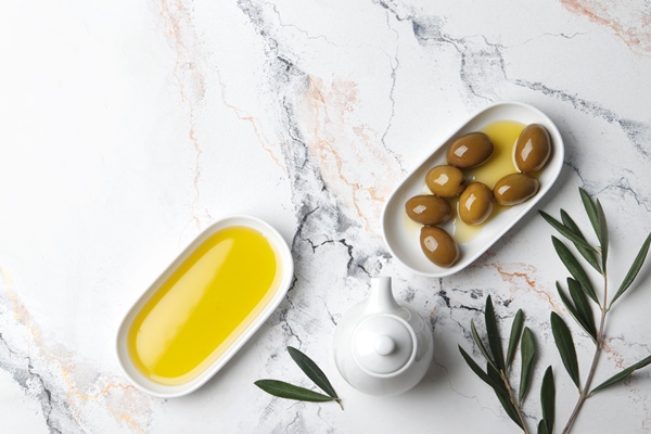 composition green olives oil spices olive branch gravy boat marble background space - Паста с брокколи