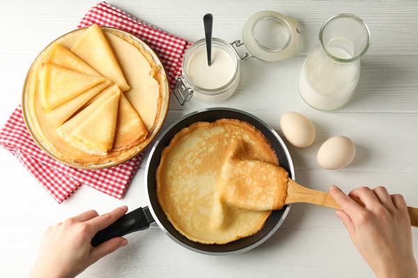 concept cooking breakfast with thin pancakes white wooden table - Заварные дрожжевые блины на опаре