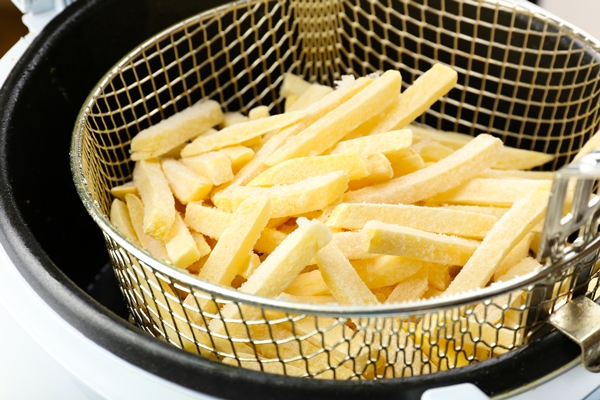 french fries deep fryer closeup - Картофель фри