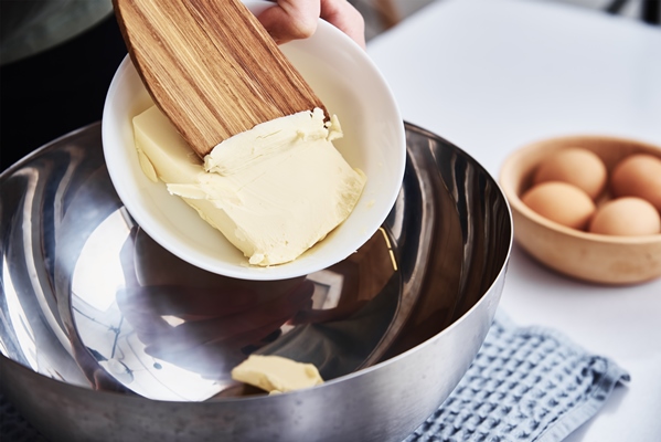 hands put butter bowl cooking recipe - Сайки домашние