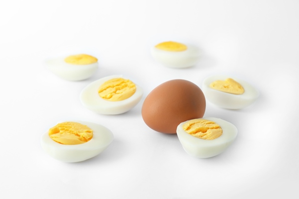 hard boiled eggs white background nutrition concept - Начинка для блинчиков из капусты и яиц