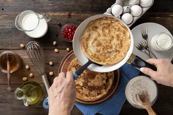 large pancakes recipe homemade rustic style top view - Старорусские блины на молочной сыворотке