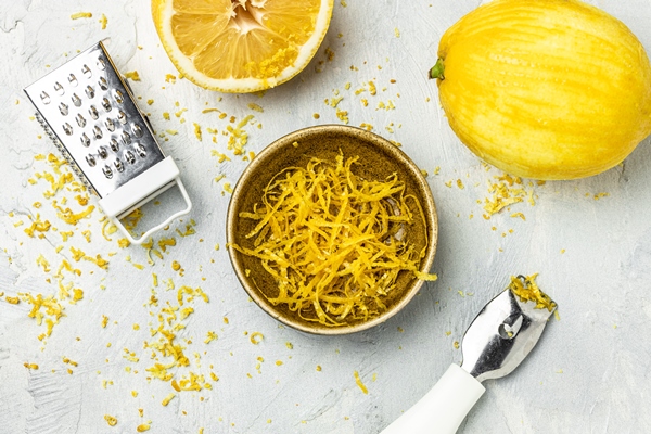 lemon zest with zester ready cook grater peel lemon zest light background banner menu recipe top view - Гремолата