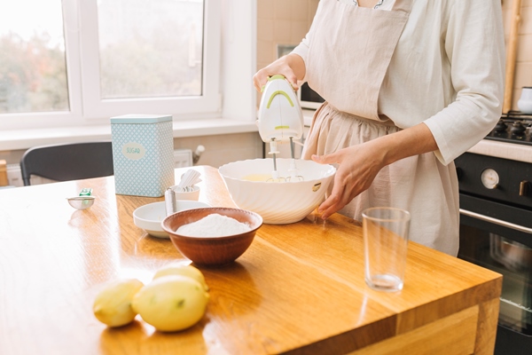 mid section woman mixing ingredients preparing pie wooden desk - Постный лимонный пирог