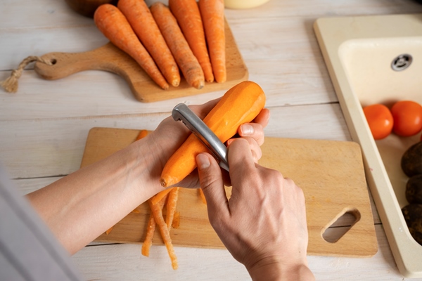 person chopping carrots kitchen - Котлеты из нута
