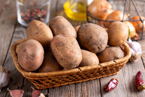 raw potato food fresh potatoes on wooden background - Картофель фри