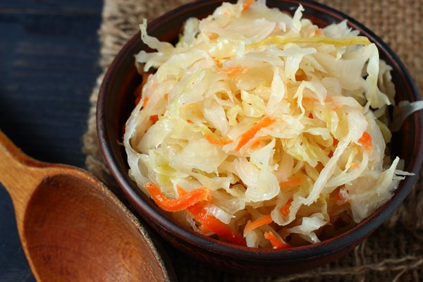 sauerkraut salad plate wooden spoon - Маринованная капуста по-петровски