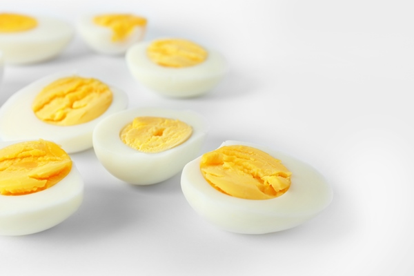 sliced hard boiled eggs white background nutrition concept - Форшмак для блинчиков