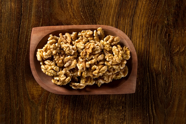 walnuts wood bowl wood table - Блинчики с козьим сыром и мёдом