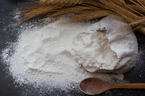 wheat flour burlap bag with wooden spoon ears wheat - Постные драники с брусничным соусом