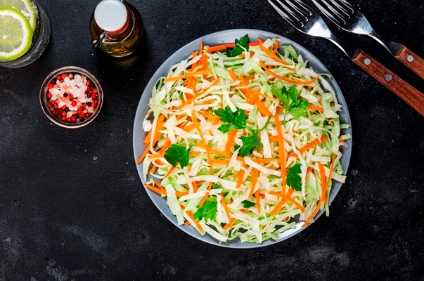 white cabbage salad coleslaw with carrot grey kitchen table background top view copy space - Салат коул слоу, постный стол