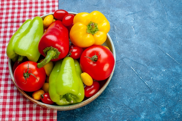 bottom view fresh vegetables cherry tomatoes different colors bell peppers tomatoes cumcuat platter red white checkered tablecloth blue table free space stock photo - Суп-пюре с портулаком