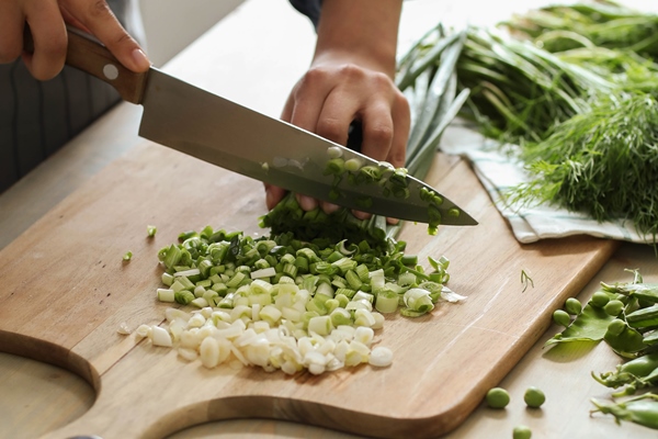 cooking chef is cutting greens kitchen - Спанакопита с тахини