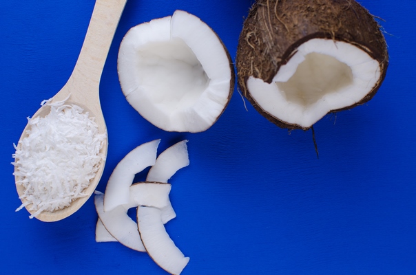 natural coconut milk coconut shavings coconut chips blue background concept healthy food - Рахат-лукум