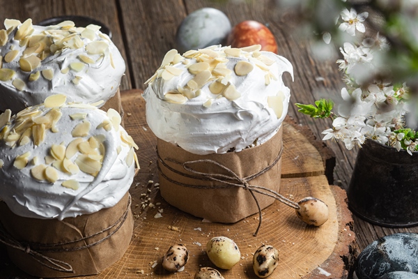 three easter cakes with white chocolate hazelnuts wooden table - Пасхальные рецепты